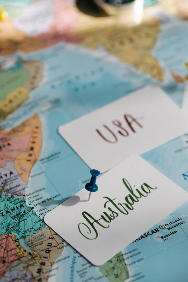 Detailed close-up of a world map with USA and Australia labeled, highlighted with pins.